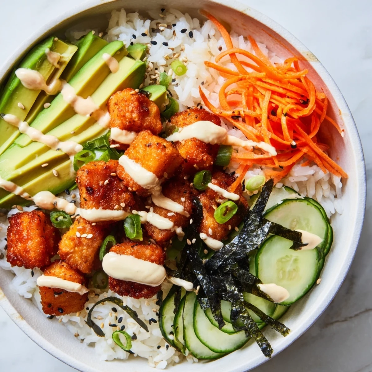 A delicious Salmon Bites Bowl, bursting with color, featuring perfectly cooked salmon and spicy mayo.