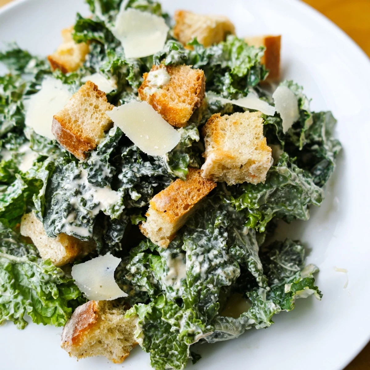 Homemade Kale Caesar Salad, featuring tender kale, Parmesan, and a delicious Caesar dressing.
