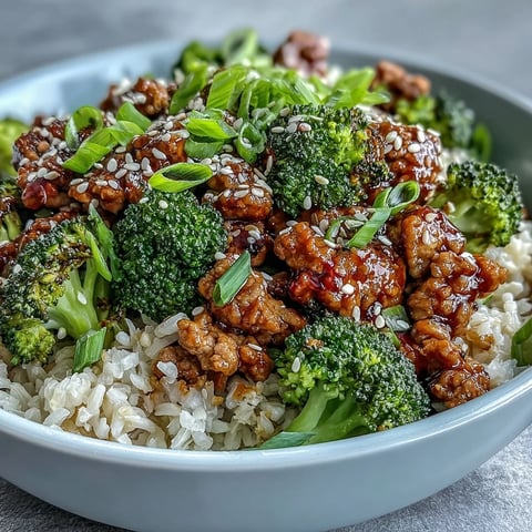Close-up of Sweet and Spicy Turkey Broccoli Bowls with steamed florets and saucy ground turkey over brown rice.
