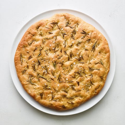 Freshly baked Quick Homemade Flatbread with hints of rosemary, crispy crust and flaky sea salt.